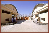 Swamishri on an observation tour of the newly built BAPS gaushala 