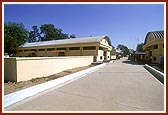 Swamishri on an observation tour of the newly built BAPS gaushala 