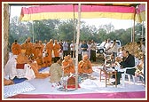 Swamishri and Shri P. D. Patel, the sponsorer of the residential school, perform the foundation-stone laying rituals 