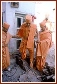 Swamishri at the shrine of Vashram Suthar's house that was sanctified by Shriji Maharaj