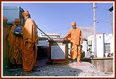 Swamishri at the shrine of Vashram Suthar's house that was sanctified by Shriji Maharaj