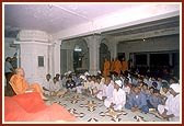 While Swamishri performs pradakshina, the local devotees listen to a discourse