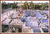 Devotees engaged in the mahapuja rituals for the first pillar-placing ceremony
