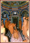 Swamishri prostrates and performs pradakshina at the memorial mandir