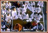 Students of BAPS Naimisharanya Gurukul sing bhajans during the puja while Swamishri is engrossed in his puja on the mandir precincts