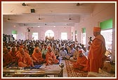Blesses the devotees (yajmans)