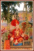 Shriji Maharaj (utsav murti) on a decorative swing