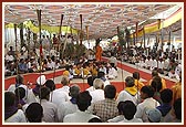 Devotees of Badalpur play the traditional trumpets and dance during Swamishri's morning walk