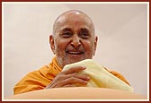 Swamishri laughs during a conversation with the sadhus