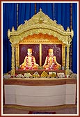 Newly installed murtis of Akshar Purushottam Maharaj and Guru Parampara in the new assembly hall at Borsad