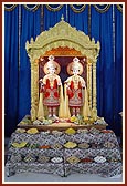 Newly installed murtis of Akshar Purushottam Maharaj and Guru Parampara in the new assembly hall at Borsad
