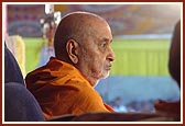 Swamishri seated in public assembly