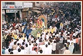 Murtis of Akshar Purushottam Maharaj on the beautifully decorated peacock float