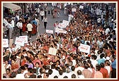 Women devotees participate in the procession