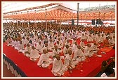 Sadhaks and parshads seated during the diksha mahapuja ceremony
