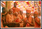 New sadhus approach Swamishri to receive the guru mantra