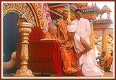 Swamishri blesses and gives the guru mantra to the newly initiated parshads