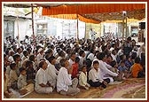 Devotees seated in the murti-pratishtha assembly