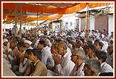 Devotees seated in the murti-pratishtha assembly