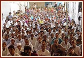 Devotees seated in the murti-pratishtha assembly