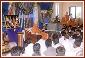Blesses the satsang assembly