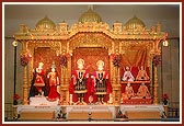 Deities in a decorative sinhasan
