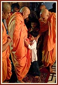 Blesses a child