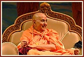 Swamishri in a joyous mood during a satsang assembly  