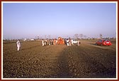 Swamishri observes and sanctifies the ground for a new BAPS mandir and school complex