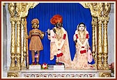 Shri Harikrishna Maharaj adorned in chandan and Shri Radha Krishna Dev