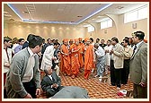 Swamishri walking through the main area of Luton Mandir