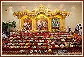 Annakut is offered to the sacred images of Shri Akshar Purushottam Maharaj, Shri Radha Krishna Dev and Guru Parampara
