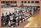 Devotees from Southend-on-Sea participate in the mahapuja vidhi