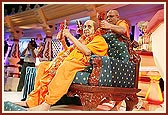 Ghanshyamcharan Swami plays the kartals with Swamishri