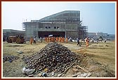 Swamishri at the under-construction giant screen film theater where the film on Nilkanth Varni will be shown on a 65 X 85 feet screen 