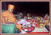 Swamishri writes his blessings in the mandir account books on Chopda Pujan day