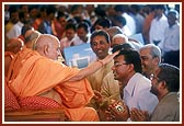 Swamishri blesses and advices the devotees during samip darshan