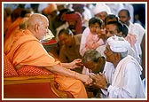 Swamishri blesses and advices the devotees during samip darshan