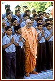 Swamishri with students having graduated in 10th grade from Pramukh Swami Vidya Mandir (school) in Sarangpur