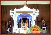 With a symbolic Akshar Deri in the backdrop Swamishri had his sofa moved to the side in the evening satsang assembly