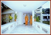 Swamishri departs from his room for his morning puja