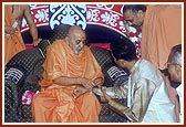Swamishri blesses a youth for his marriage