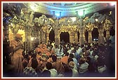 A welcome assembly is held beneath the mandir dome