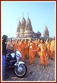 Swamishri sanctifies and blesses a new motorcycle and its owner respectively&nbsp;&nbsp;