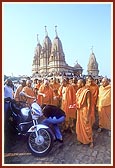 Swamishri sanctifies and blesses a new motorcycle and its owner respectively&nbsp;&nbsp;
