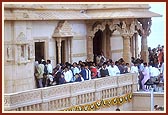 Devotees arrive for darshan at the mandir