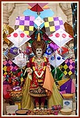 Thakorji surrounded by kite decorations on the occasion of Uttarayan