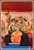 &nbsp;Swamishri seated on the grand stage during the Uttarayan assembly