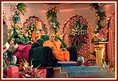&nbsp;Swamishri seated on the grand stage during the Uttarayan assembly