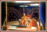 Swamishri blesses the volunteers of the tribal areas during an assembly held in the compound of 'Pramukh Paper Products'